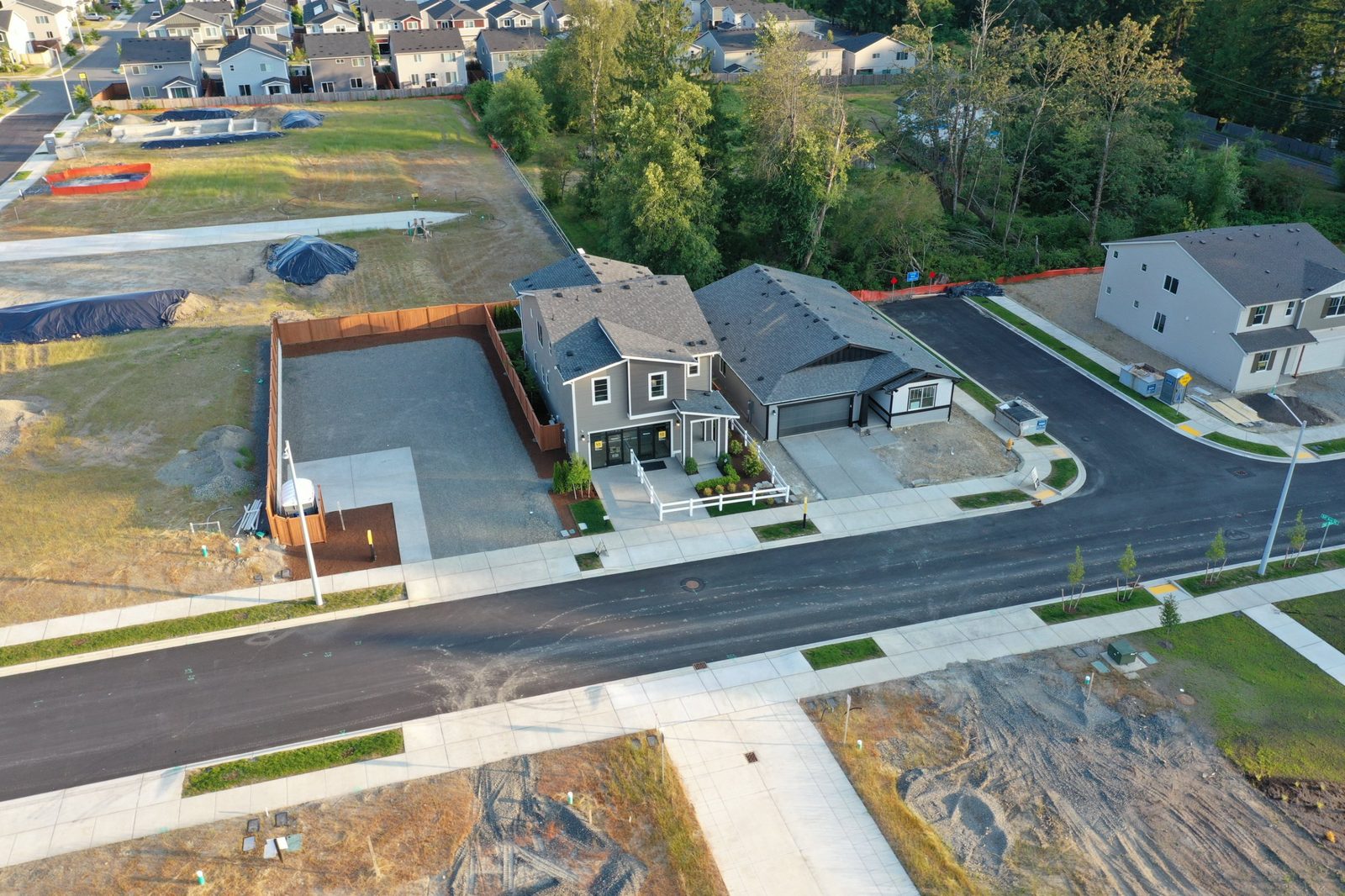 Oblique aerial photo of a newly built home on a corner lot in a new subdivision